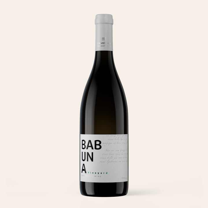 Bottle of Tikveš Babuna White, a single vineyard white wine of Albariño, Chardonnay and Viognier, on a cream background