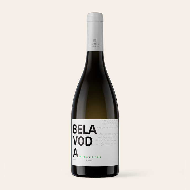 Bottle of Bela Voda White, an oaked white wine of Chardonnay and Grenache Blanc, on a cream background