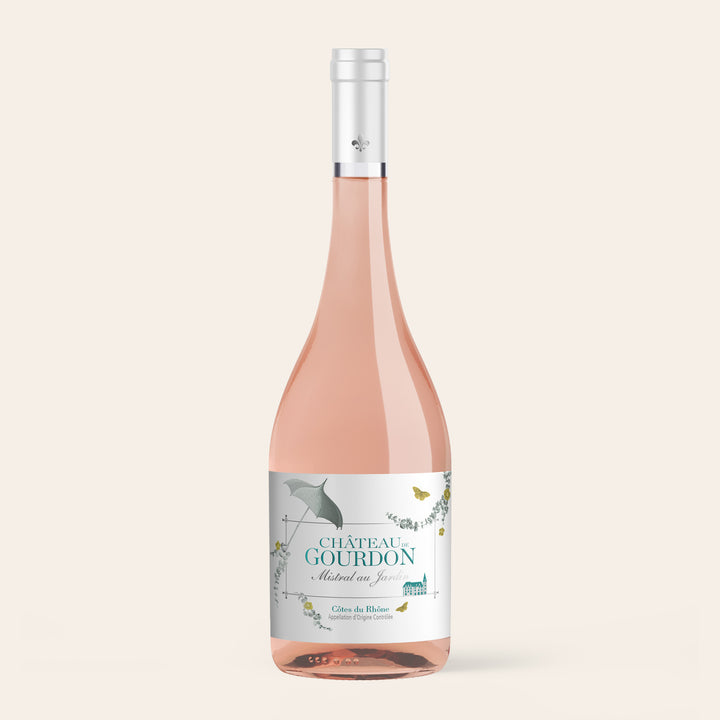 Bottle of Mistral au Jardin, a dry Côtes du Rhône rosé from Château de Gourdon, on a cream background